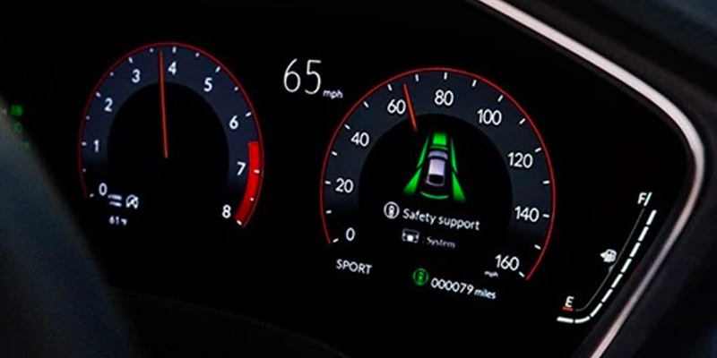 2025 Acura dashboard display showing speed at 65 mph, safety support indicator, and fuel gauge.